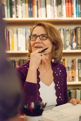 Photo of Kristin Ohlson signing books at Powell's - Photo by Kristin Beadle